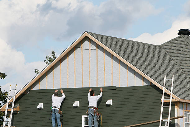 Professional Siding Contractor technician working in East Norwich, NY